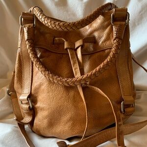 The Sak tan genuine leather drawstring hobo style crossbody bag/purse
